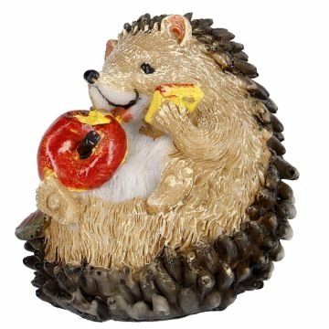 Igel mit einem Apfel, sitzend