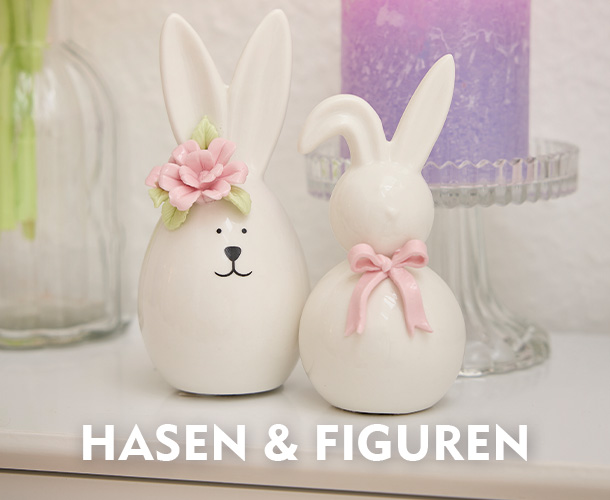 Zwei Keramikhasen mit rosafarbenen Akzenten verlinkt auf die Kategorie Osterhasen & Figuren
