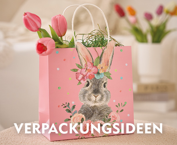 Rosafarbene Ostert&uuml;te mit Hasenmotiv, gef&uuml;llt mit Tulpen verlinkt auf Osterverpackungen