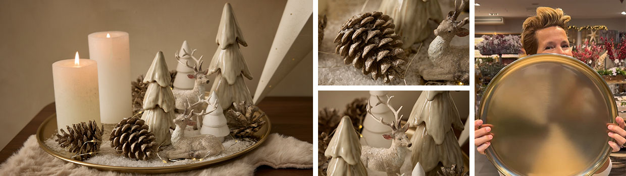 Winterlich-dekorierte Deko-Schale in Gold mit Tannen und Kerzen wird präsentiert